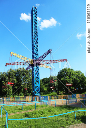 Metal swing in the park in summer. Summer activities in the park 136363329