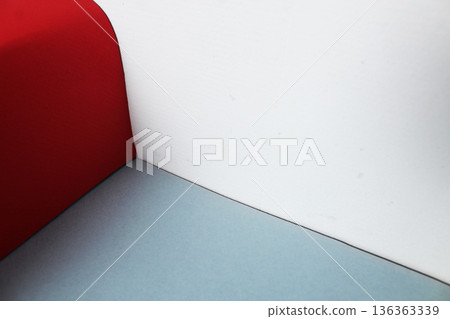 The corner is made of red, white and gray wall flowers. Color combination 136363339