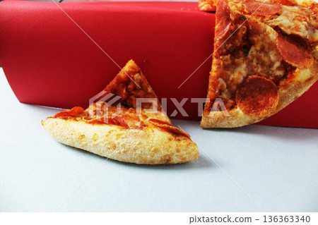 The pizza moved from the red background table to the white one. Funny photos with pizza The pizza moved from the red background table to the white one. Funny photos with pizza 136363340