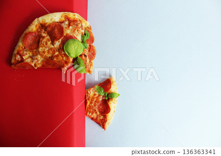Pizza slices with basil on a red white background. Flying Pizza 136363341