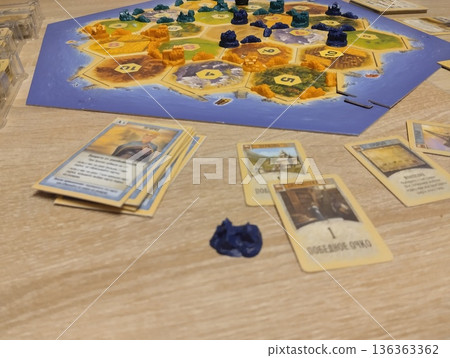 Mozyr, Belarus, April 10 2024: Board Game Catan Colonizers Calculation of Winner's Game Points Mozyr, Belarus, April 10 2024: Board Game Catan Colonizers Calculation of Winner's Game Points 136363362