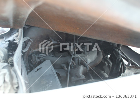 Car interior parts in white foam after a fire. Car repair 136363371