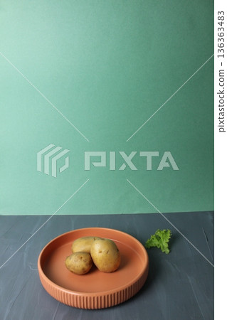 Potatoes on a plate. The concept of vegetarianism harvest 136363483