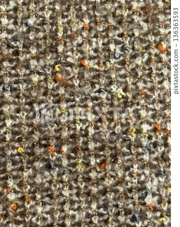 Closeup of textured brown fabric with colorful specks suitable as a textile pattern background Closeup of textured brown fabric with colorful specks suitable as a textile pattern background 136363593