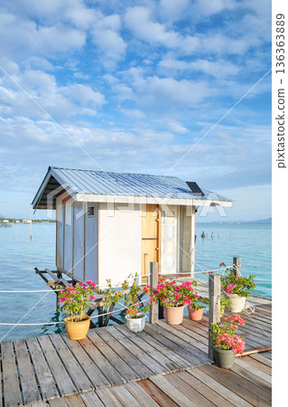 Cabin on a wooden platform over water, Semporna district, Borneo, Malaysia. Cabin on a wooden platform over water, Semporna district, Borneo, Malaysia. 136363889