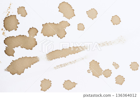 Various prints, blots and stains from spilled black coffee on white paper, top view 136364012