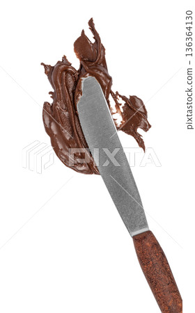 Knife with chocolate spread isolated on white background Knife with chocolate spread isolated on white background 136364130