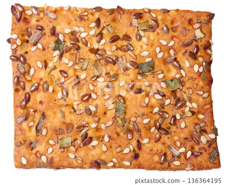 Crispy bread sprinkled with flax and sesame seeds, dried herbs, golden baked crust. Crispy bread sprinkled with flax and sesame seeds, dried herbs, golden baked crust. 136364195