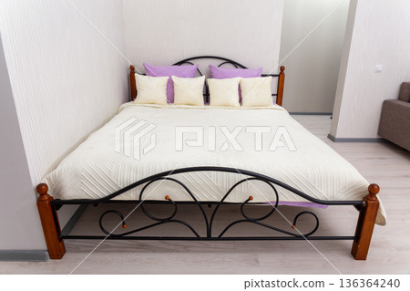 Bright modern bedroom with double bed 136364240