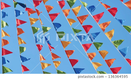 Colorful triangular flags waving in the wind in Moscow 136364595