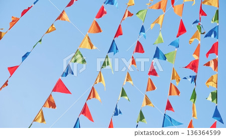 Colorful triangular flags waving in the wind in Moscow Colorful triangular flags waving in the wind in Moscow 136364599