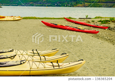 Kayaks on fjord shore, Flam, Norway Kayaks on fjord shore, Flam, Norway 136365204