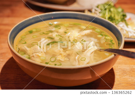 Vietnamese national noodle dish: rice flour noodles, pho ga, close-up 136365262