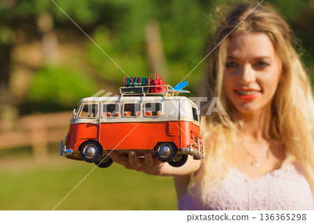 Woman holding hippie van object model 136365298
