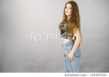 Beautiful young woman with brown hair Beautiful young woman with brown hair 136365504