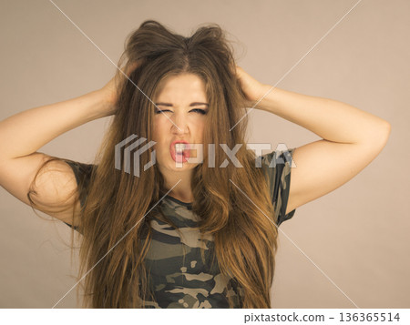Beautiful young woman with brown hair 136365514