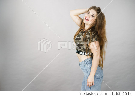Beautiful young woman with brown hair Beautiful young woman with brown hair 136365515