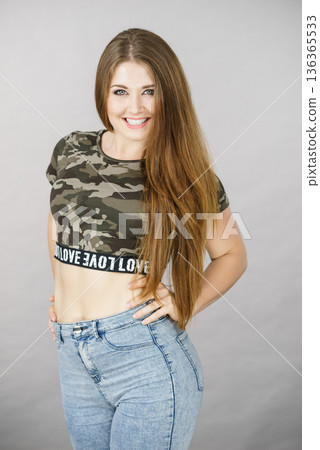 Beautiful young woman with brown hair 136365533