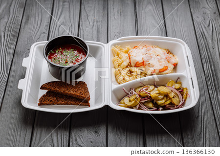 Ukrainian borscht in takeaway lunch box with pasta, baked chicken and pickles Ukrainian borscht in takeaway lunch box with pasta, baked chicken and pickles 136366130
