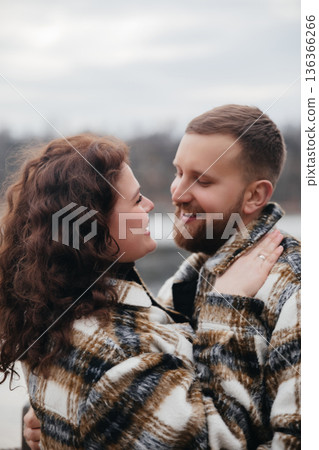 Couple enjoys time together while celebrating their love near the water during Valentines Day 136366266