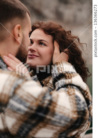 Couple shares a tender moment in a natural setting on Valentines Day celebrating their love and connection in a romantic atmosphere 136366273