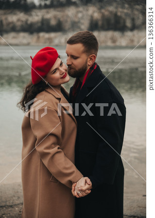 Couple enjoys time together on Valentines Day by the water, celebrating their love and connection in nature 136366314