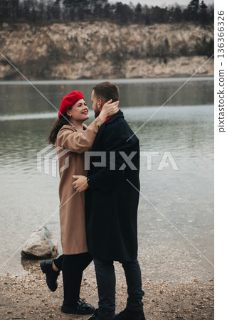 Couple shares a romantic moment by the water on Valentines Day celebrating their love together 136366326