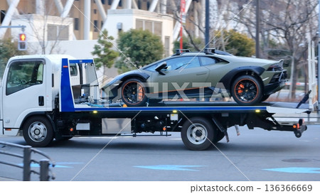 Image of a carrier car transporting a sports car 136366669