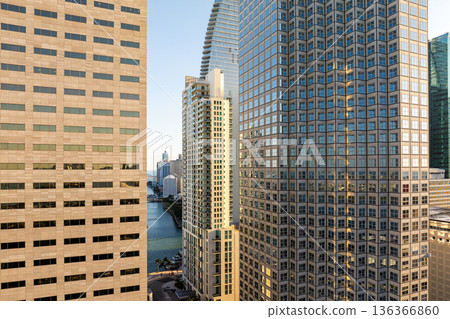 Miami downtown office district in Florida, USA at sunset. High commercial and residential skyscraper buildings in modern American coastal city 136366860
