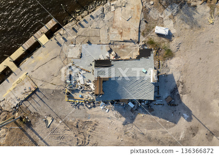 Hurricane Milton storm surge severe damage to waterfront house on Manasota Key, Florida. Destroyed home on gulf coast Hurricane Milton storm surge severe damage to waterfront house on Manasota Key, Florida. Destroyed home on gulf coast 136366872
