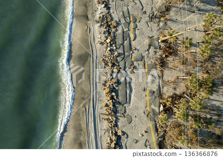 Hurricane Milton storm surge destroyed Manasota Key road at Blind Pass Beach. Severe damage to waterfront infrastructure in Florida 136366876