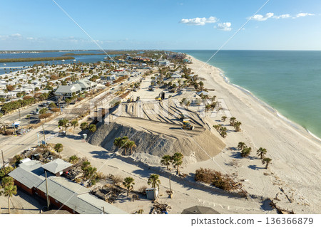 Sand recipient site for residents to dump sand after hurricane Milton storm surge. Huge sand piles at Englewood Beach on Manasota Key. Natural disaster aftermath cleanup Sand recipient site for residents to dump sand after hurricane Milton storm surge. Huge sand piles at Englewood Beach on Manasota Key. Natural disaster aftermath cleanup 136366879