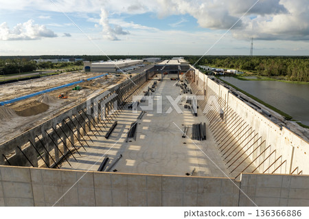 USA logistics and distribution industry development. Construction of warehouse concrete and metal structure of industrial building USA logistics and distribution industry development. Construction of warehouse concrete and metal structure of industrial building 136366886