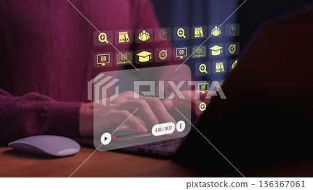 Person using a laptop computer with virtual education icons and video recording in home, representing online learning, e-learning technology, digital education, and virtual training concepts. 136367061