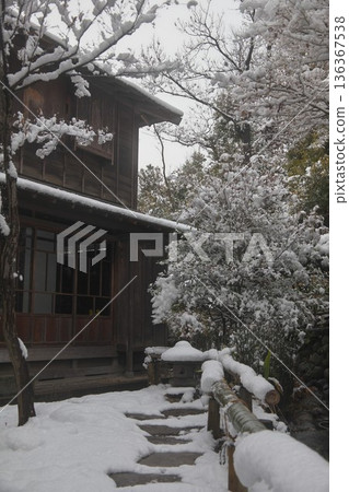Snowy backyard of an old house 136367538