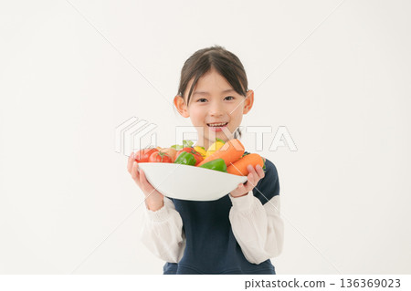 Girls with vegetables 136369023