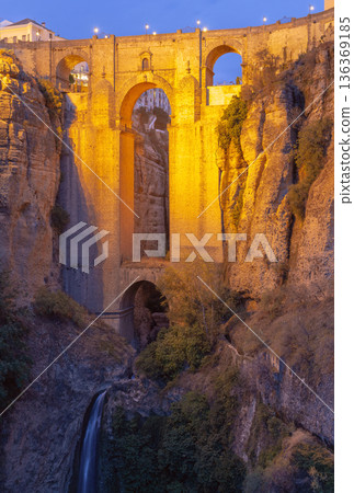 Evening View of Puente Nuevo in Ronda with Illuminated Bridge and Waterfall Evening View of Puente Nuevo in Ronda with Illuminated Bridge and Waterfall 136369185