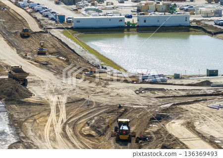 Roadworks construction site on American highway. Development of city transportation crossroads 136369493