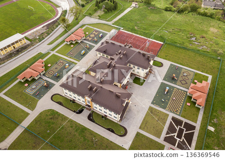 Aerial view of new prescool building in residential rural area. 136369546