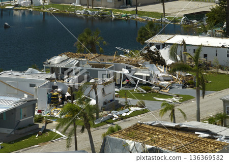 Collapsed and damaged mobile homes after hurricane Ian swept through Florida residential area. Consequences of severe natural disaster Collapsed and damaged mobile homes after hurricane Ian swept through Florida residential area. Consequences of severe natural disaster 136369582