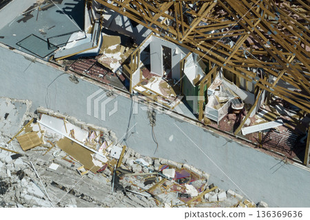 Natural disaster and its consequences. Hurricane Ian destroyed house roof and walls in Florida residential area 136369636