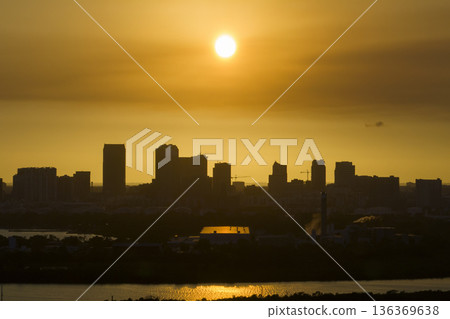 Aerial view of downtown district of Tampa city in Florida, USA at sunset. Dark silhouette of high skyscraper office buildings in modern american midtown 136369638