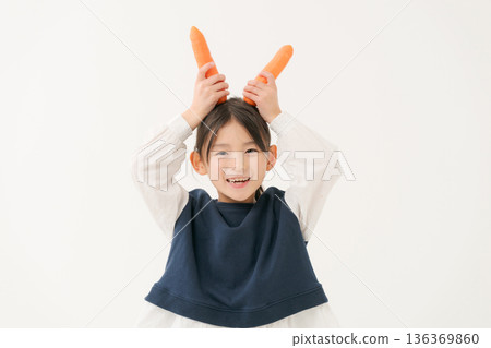 Girl with carrot 136369860