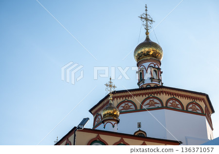 Beautiful Christ cross decorated on the top of an Orthodox church in Irkutsk, Russia. Orthodoxy believes that the Christian Faith and the Church are inseparable. 136371057