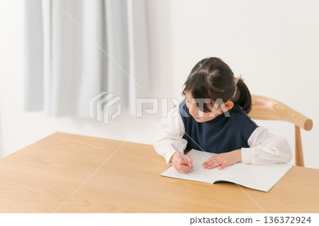 Elementary school girl studying Elementary school girl studying 136372924