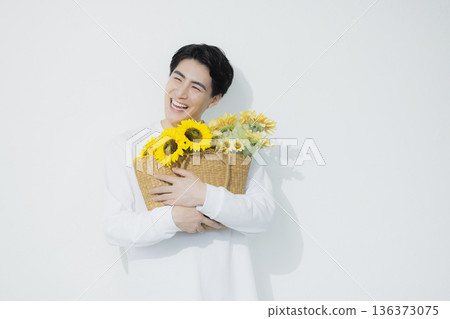 Man with sunflower Man with sunflower 136373075