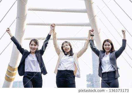 Banner Happy Diversity Teams multiethnic Partners standing with hands together in modern city. Panorama Teamwork group of multi racial confident happiness people joining trust teams partners outdoor 136373173