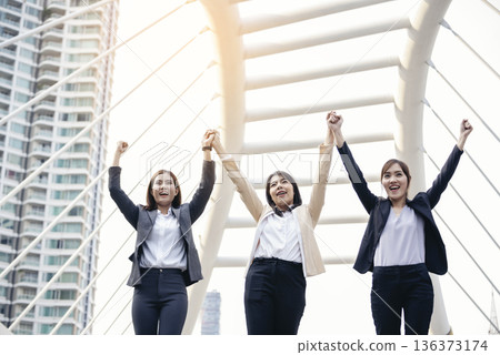 Banner Happy Diversity Teams multiethnic Partners standing with hands together in modern city. Panorama Teamwork group of multi racial confident happiness people joining trust teams partners outdoor 136373174
