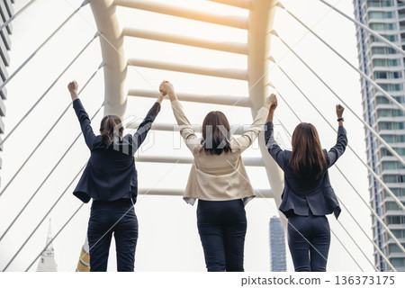 Banner Happy Diversity Teams multiethnic Partners standing with hands together in modern city. Panorama Teamwork group of multi racial confident happiness people joining trust teams partners outdoor 136373175