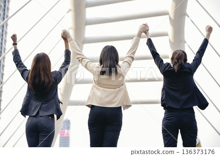 Banner Happy Diversity Teams multiethnic Partners standing with hands together in modern city. Panorama Teamwork group of multi racial confident happiness people joining trust teams partners outdoor 136373176